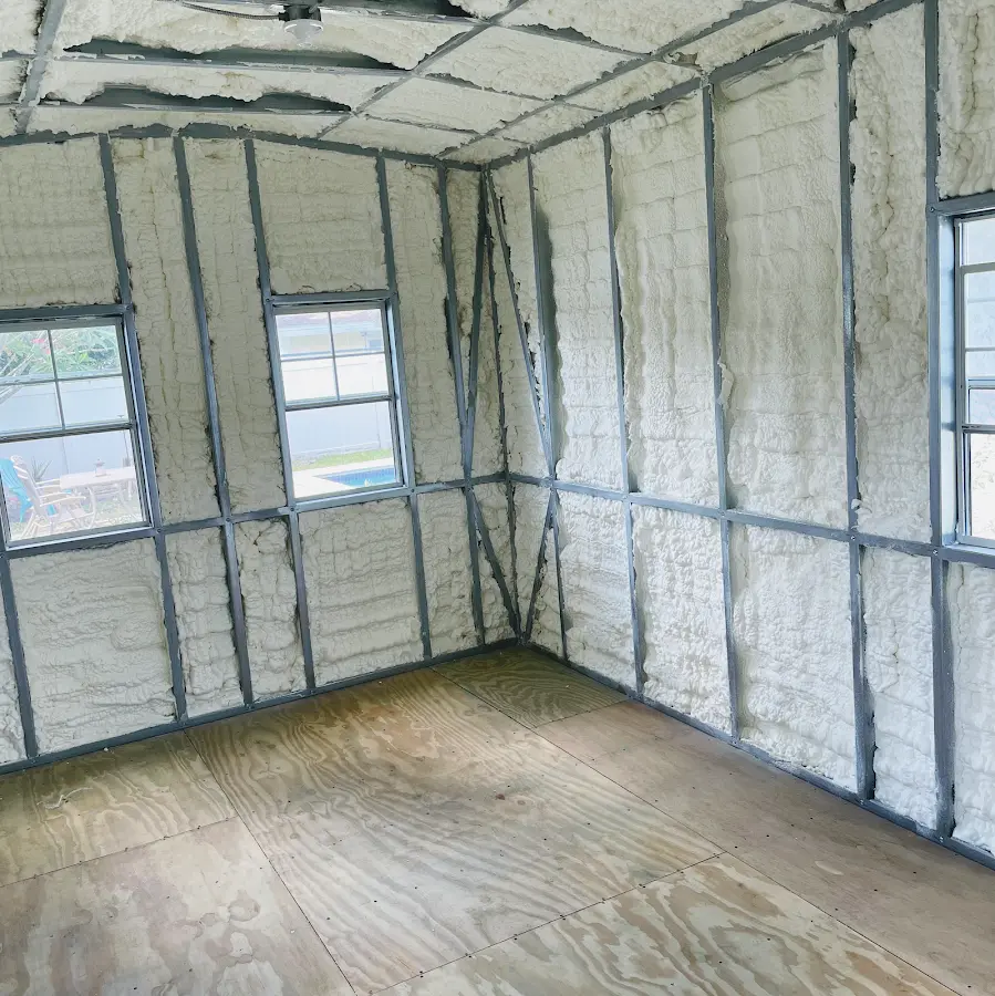 Closed-cell spray foam insulation applied to wall cavities in a residential project in Crawford